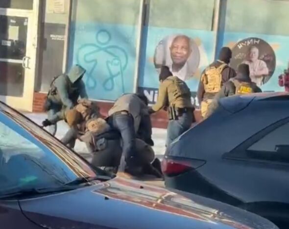 The man being confronted by ICE