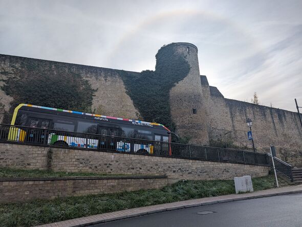 Bus in luxembourg driving past a castle