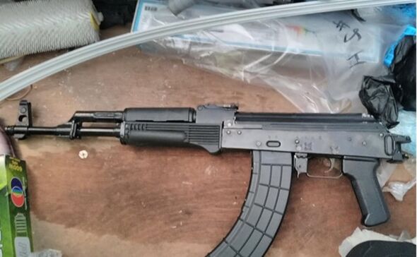 Guns and ammo found at one of the gangs addresses