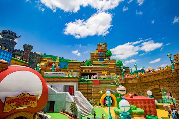 You enter the Mushroom World through a giant green Warp Pipe–slash-escalator and land in the middle of a surreal video game land