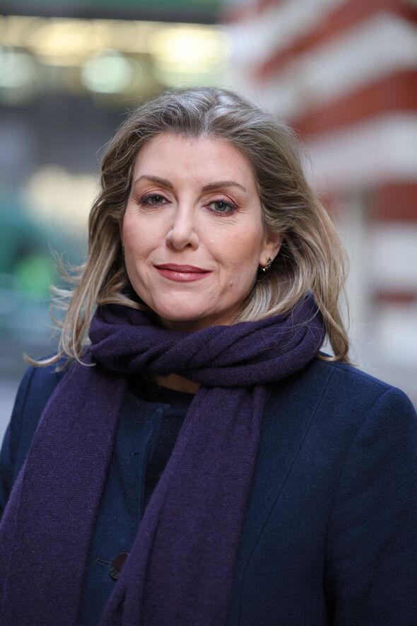 Dame Penny Mordaunt in a London street