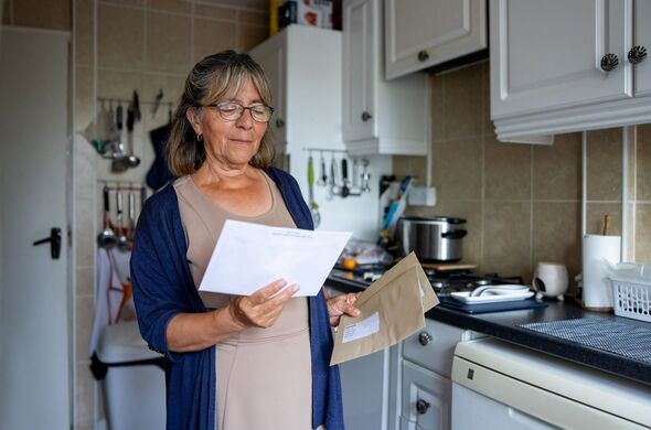 Senior woman at home checking letters at home