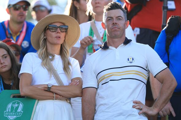 Rory McIlroy stands with Erica Stoll