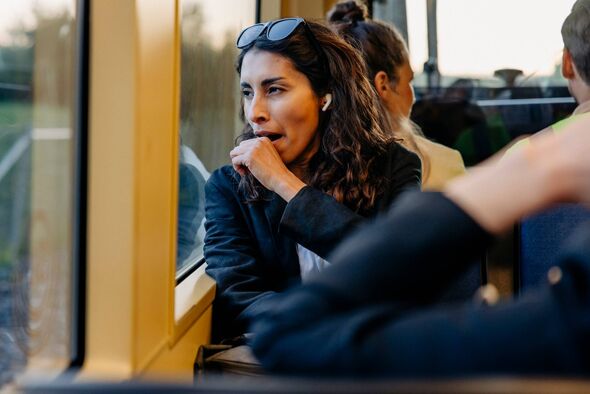 Woman yawning tired on the bus