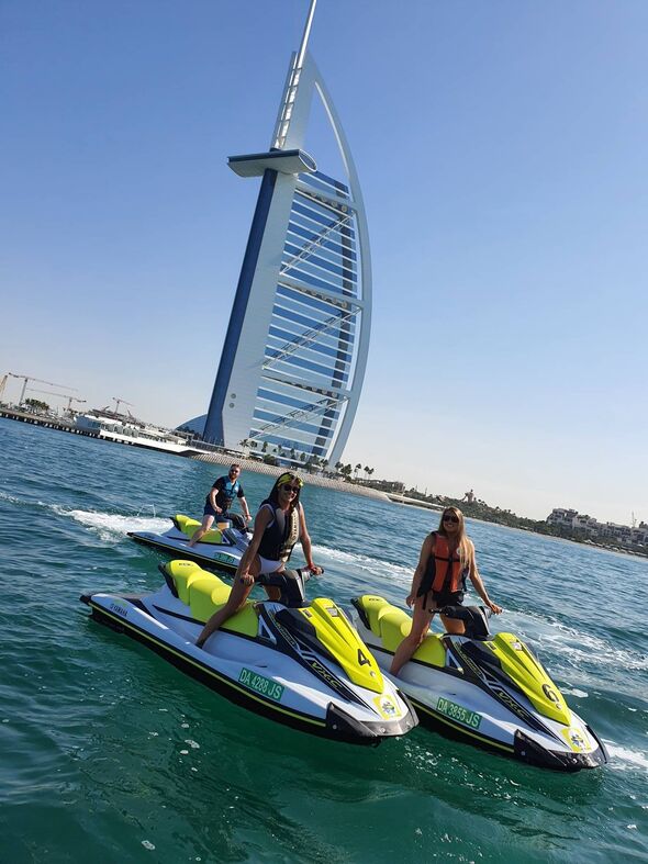 Camilla, her husband Jim in and a friend on jet skis in Dubai