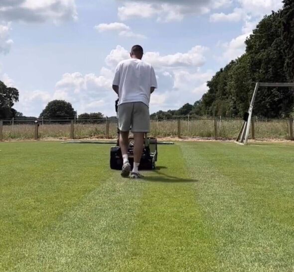 Henri Lansbury mowing his lawn