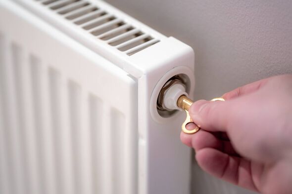 An individual is inserting a key into radiator