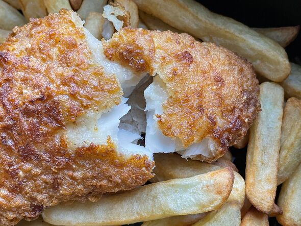 Full frame image of golden brown, fresh crunchy chips / french fries and battered cod fillet cooked in air fryer, flakey white fish, healthier alterna