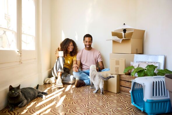 Two people who have just brought their first house