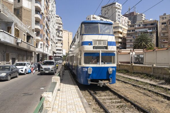The famous double decker tramway on the city street. Alexandria, Egypt