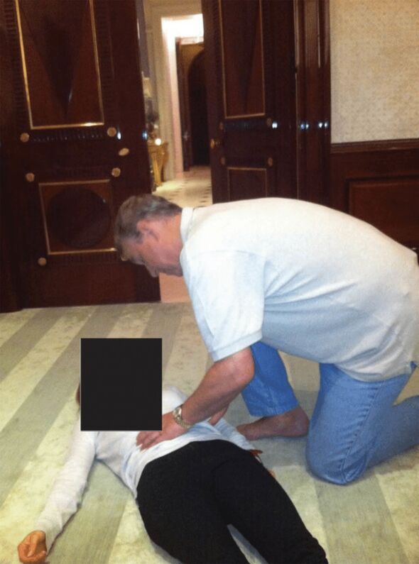 A man kneeling next to a woman