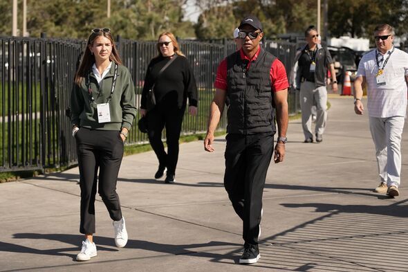 Kai Trump and Tiger Woods walk next to each other