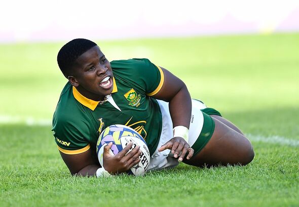 Lusanda Dumke of South Africa celebrated after scoring a try.