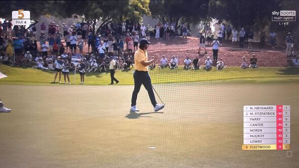 Tommy Fleetwood walks after sinking a putt
