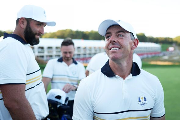 Jon Rahm and Rory McIlroy of Team Europe celebrate