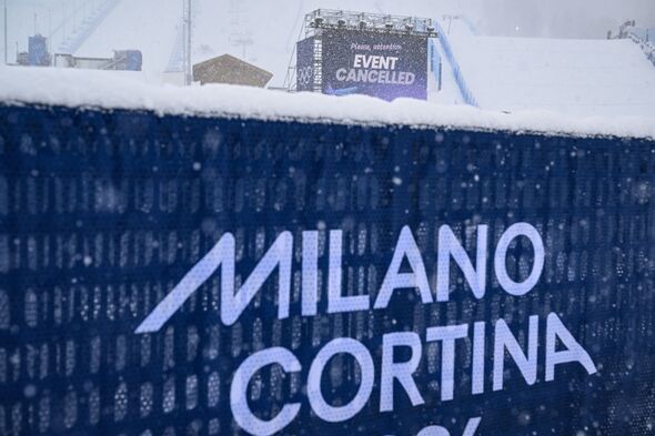 A giant screen indicates the weather cancellation