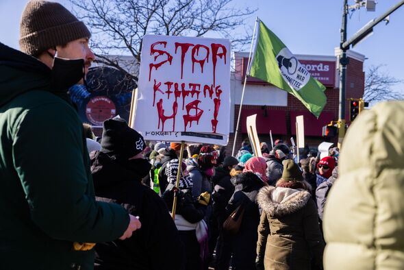 Protesters gather near the scene of the shooting