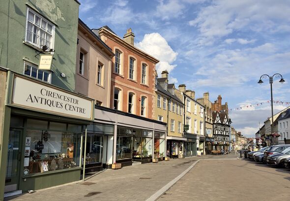 A row of shops in the market town of Cirencester, Cotswolds.