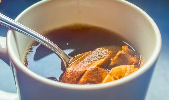 Picture of someone brewing a cup of tea