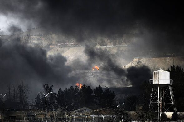 TEHRAN, IRAN - MARCH 8: Black smoke rises after fires broke out following US-Israel attacks targeting some oil storage facilitie