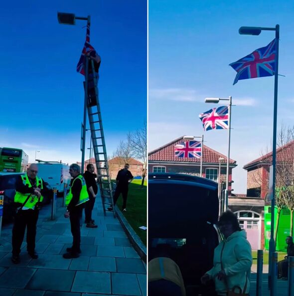 The group hoisting flags on lampposts outside the hospital