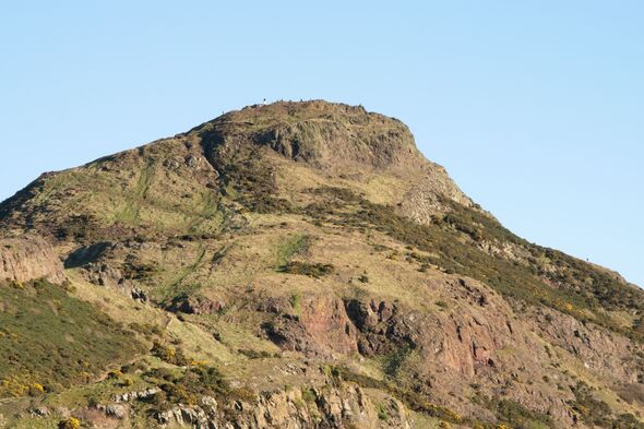 Beautiful view of Arthur's Seat hill in Edinburgh, Scotland under a pale cloudless sky