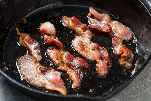 Crispy Bacon Cooking in a Cast Iron Skillet
