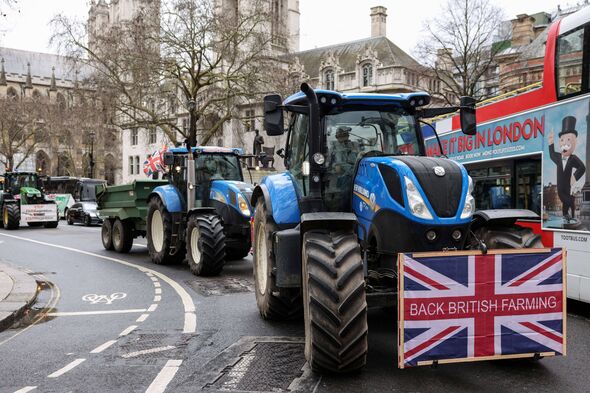 Farm tractors decorated with placards to support British farmers and to protest against Britain's Prime Minister Keir Starmer, d
