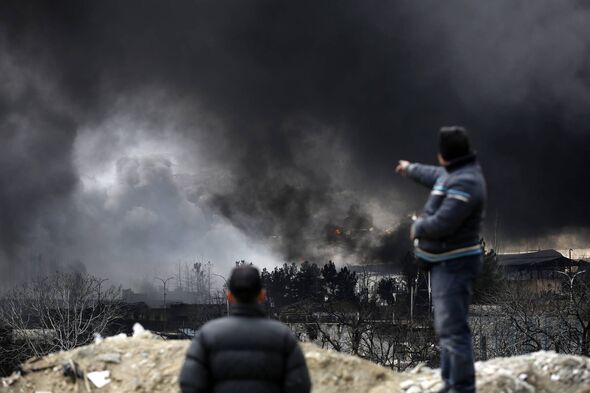 TEHRAN, IRAN - MARCH 8: Black smoke rises after fires broke out following US-Israel attacks targeting some oil storage facilitie