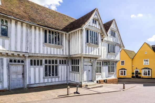The half timbered Guildhall dating from the 16th century in the marketplace in the ancient town of Lavenham, Suffolk UK