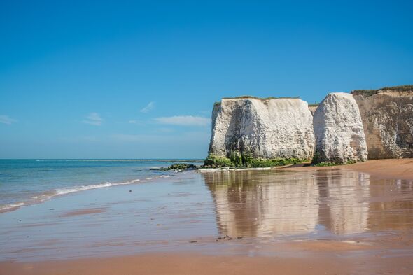 Botany Bay beach with golden sand, gentle waves, and striking white cliffs in Broadstairs, England