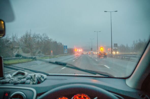 Fast moving traffic on wet and misty UK motorway