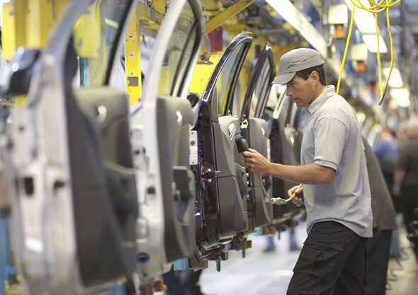 Car Plant Worker On Production Line
