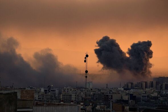 A plume of smoke rises following a U.S.-Israeli military strike in Tehran, Iran, Tuesday, March 3, 2026