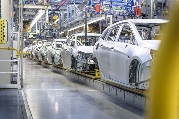 View of cars on production line in factory
