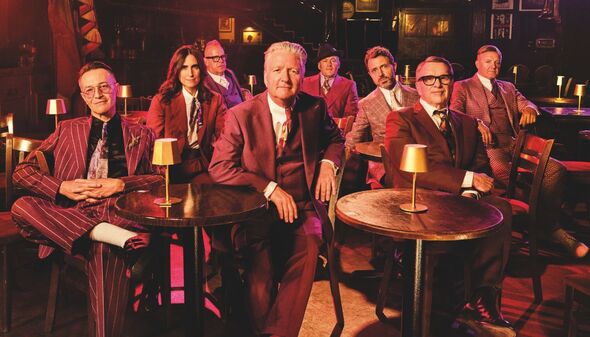 Squeeze sit in a speakeasy style location for a publicity shot