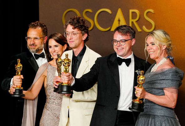 Winners celebrate the Best Documentary Oscar for Mr. Nobody Against Putin at the Academy Awards in Los Angeles.