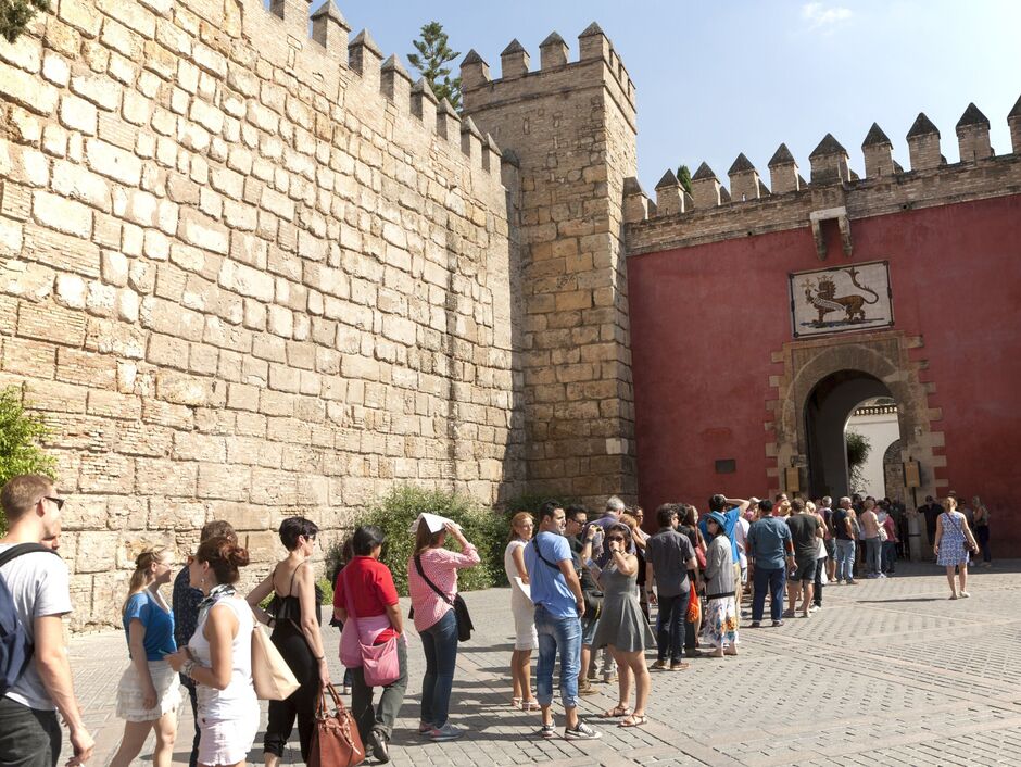 Line of tourists queuing to enter the Alcazar in Seville
