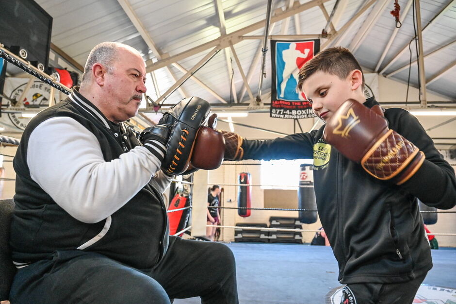 Archie Hayes, blind boxer at Paddy John's Gym in Bristol. Archie with his trainer Andy O'Kane.March 18 2026. Archie Hayes as a baby. A young blind boy