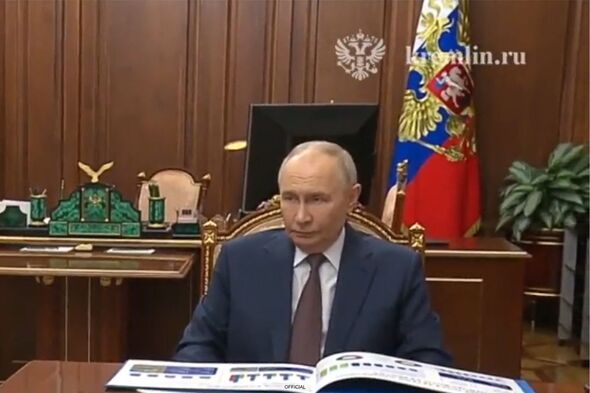 Vladimir Putin appears in pre-recorded footage