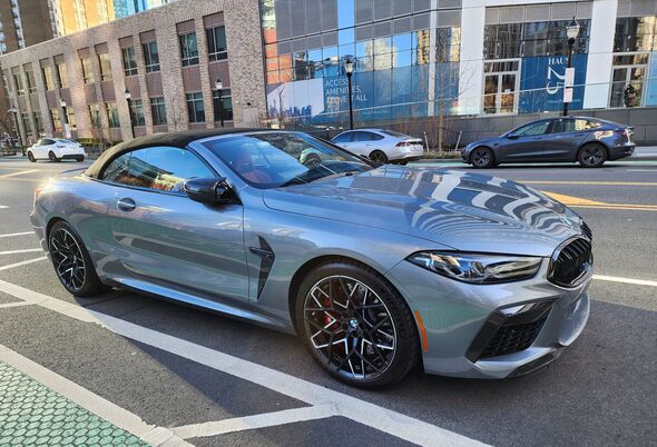BMW M8 convertible cabriolet car parked outdoor, corner view