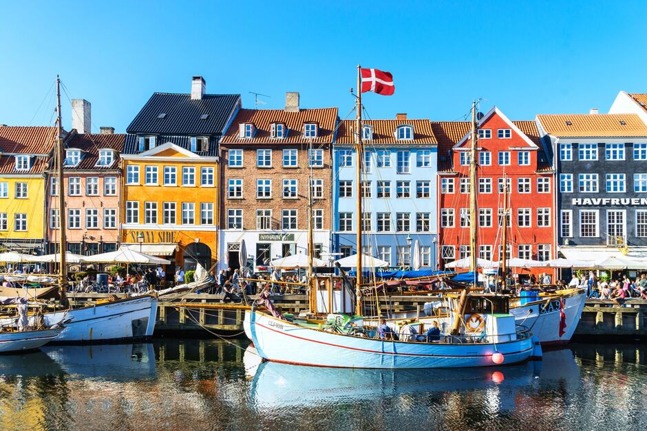 Copenhagen Nyhavn panorama city crowds enjoying sunshine restaurants bars Denmark
