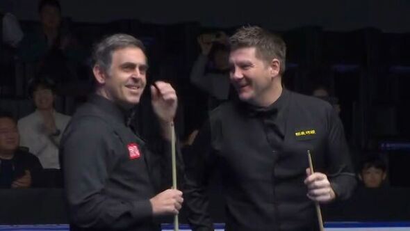 Ronnie O'Sullivan with Ryan Day after his 153 break