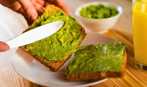 Picture of someone making avocado toast