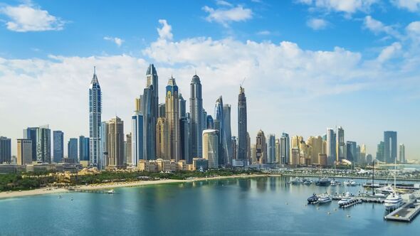 Dubai Marina in the UAE, modern skyscrapers and a port with luxury yachts