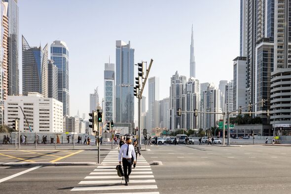 A view of skyscrapers and a few commuters in Dubai Business District