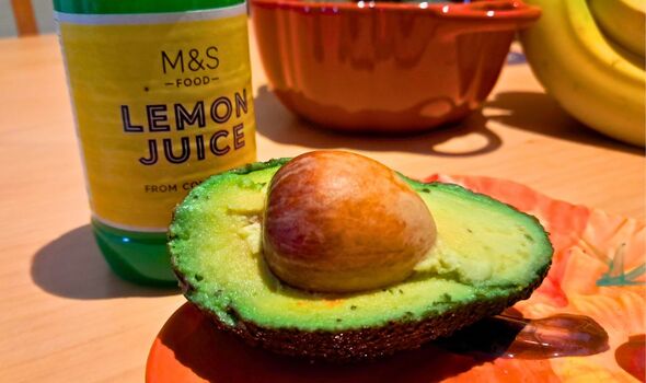 Picture of an avocado slice next to lemon juice.