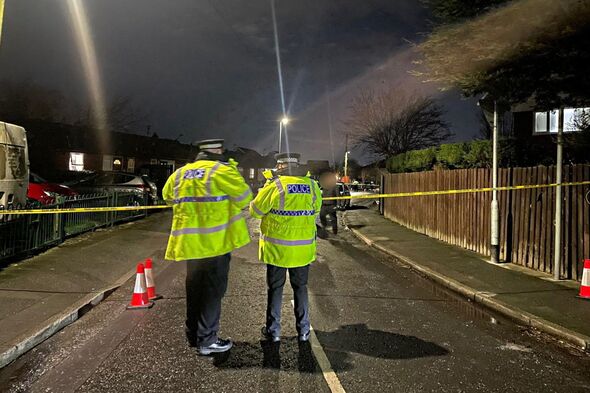 A view of police officers and a cordon at the scene of the attack