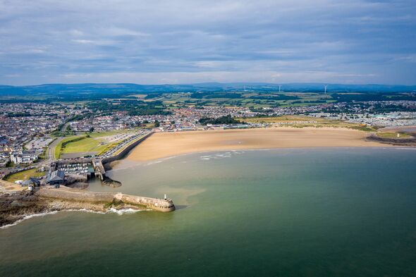 Aerial view of Porthcawl beach harbour and fun fair in South Wales UK