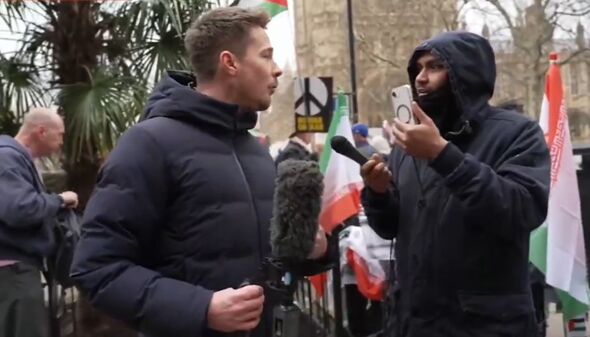 Alex Armstrong being confronted by a protestor live on air on GB News